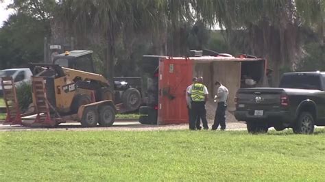 1 hospitalized after landscaping truck overturns, spills gravel in Southwest Ranches